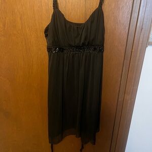 Black dress with sequin strip around waist.